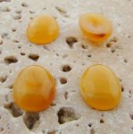 14X10mm. HONEY AMBER SHINY MARBLE OVAL CABOCHONS - Lot of 48